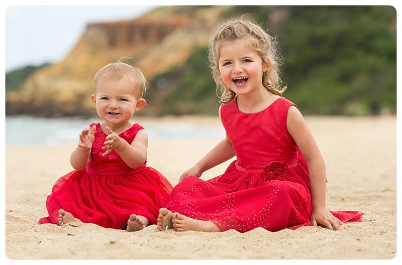 Sisters At The Beach Cute Little Girls in Dresses